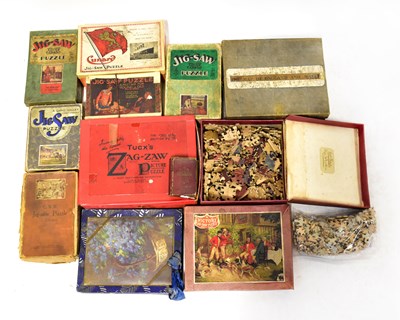 Lot 395 - A collection of vintage jigsaws, to include a...