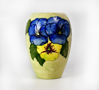 Lot 265 - MOORCROFT; a pale green ground 'Pansy' pattern...