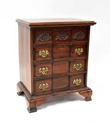 Lot 41 - A reproduction mahogany chest of four long...
