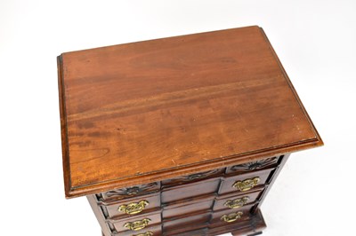 Lot 41 - A reproduction mahogany chest of four long...