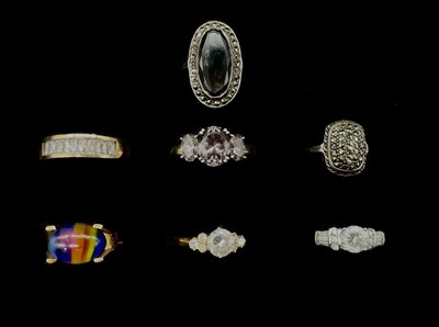 Lot 1182 - Seven dress rings including three yellow metal...