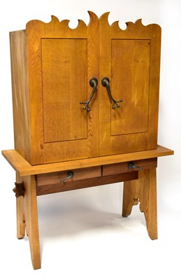 Lot 27 - An oak cupboard on stand, the top with pair of...