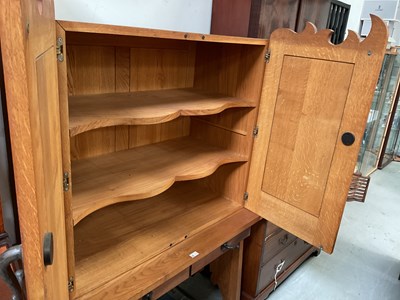 Lot 27 - An oak cupboard on stand, the top with pair of...