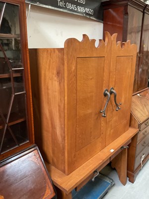 Lot 27 - An oak cupboard on stand, the top with pair of...
