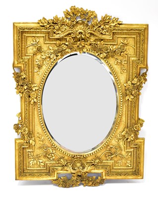 Lot 118 - A large ornate gilt framed mirror, with oval...