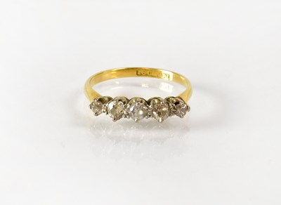Lot 817 - An 18ct yellow gold ring set with five...