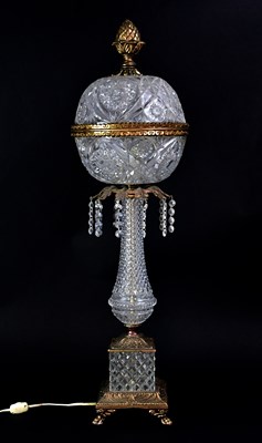 Lot 167 - A pressed glass and gilt metal table lamp, the...