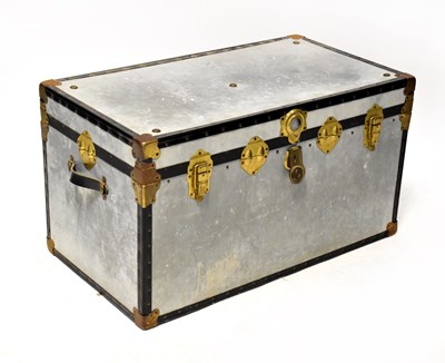 Lot 333 - An alloy travel trunk with studded decoration...