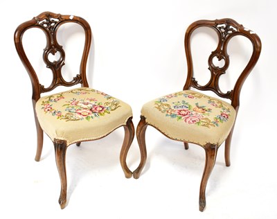 Lot 61 - A set of six Victorian walnut balloon back...