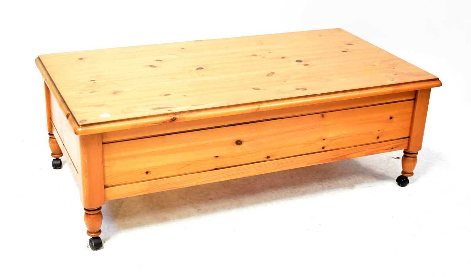 Lot 25 - A Ducal waxed pine coffee table on castors,...