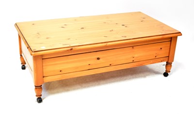 Lot 25 - A Ducal waxed pine coffee table on castors,...