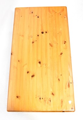 Lot 25 - A Ducal waxed pine coffee table on castors,...
