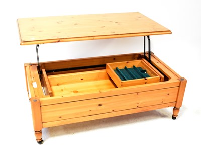 Lot 25 - A Ducal waxed pine coffee table on castors,...