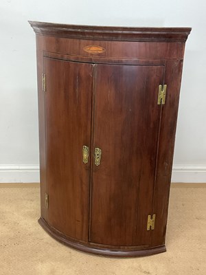 Lot 682 - A George III bowfronted hanging corner...