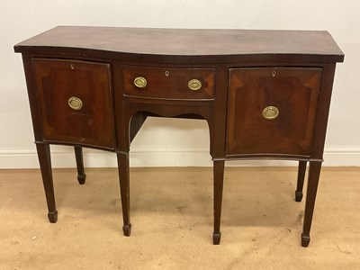 Lot 683 - A mahogany serpentine outline sideboard of...