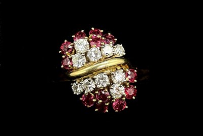 Lot 1147 - An 18ct yellow gold diamond and ruby cocktail...