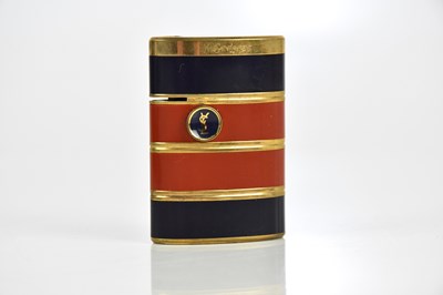 Lot 680 - YVES SAINT LAURENT; a gold tone and black and...