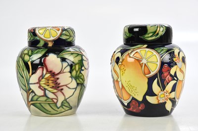 Lot 638 - MOORCROFT; two ginger jars, 'Lemon and Blossom'...