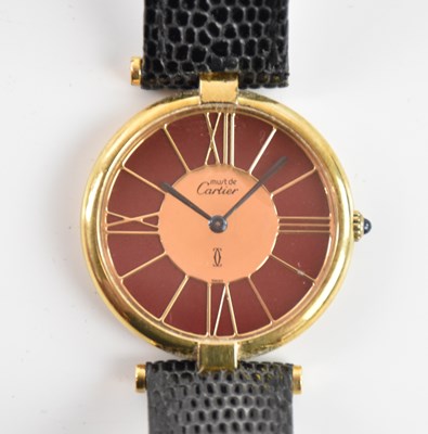 Lot 593 - CARTIER; a lady's Must de Cartier silver gilt...