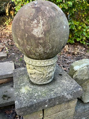 Lot 149 - A stone ball, diameter 26cm, on a cast stand....