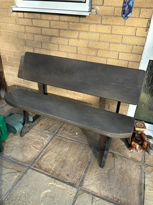 Lot 147 - A cast iron bench with wooden back and seat,...