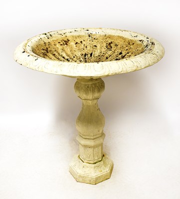 Lot 138 - A cast iron garden urn of circular form with...