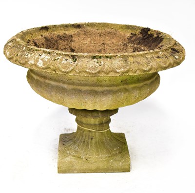Lot 136 - A reconstituted stone garden urn with egg and...
