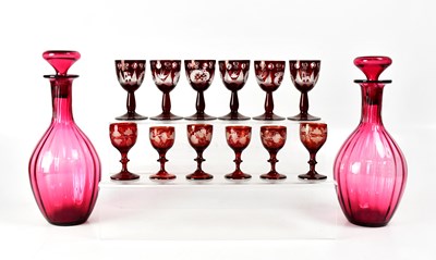 Lot 317 - A pair of Victorian cranberry glass decanters...