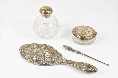Lot 1099 - A hallmarked silver dressing table set with...