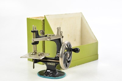 Lot 1377 - SINGER, USA; a miniature hand-wound sewing...