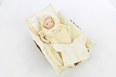 Lot 870 - A 19th century porcelain headed doll in period...