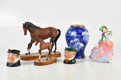 Lot 660 - ROYAL DOULTON; a blue and white children's...