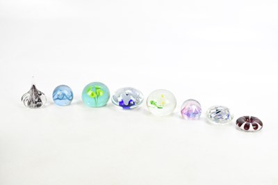 Lot 802 - A collection of eight paperweights including...