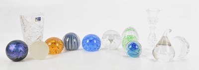 Lot 814 - A collection of decorative glass paperweights...