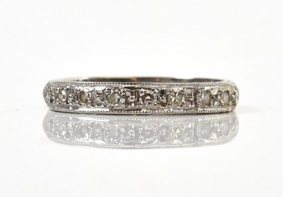 Lot 156 - An 18ct white gold diamond set nine stone...