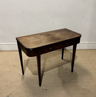 Lot 1230 - A Georgian mahogany foldover D-end tea table,...