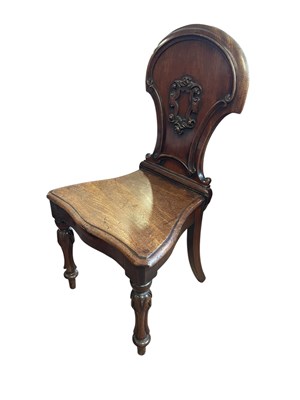 Lot 1251 - A Victorian carved mahogany hall chair, on...