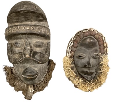 Lot 606 - Two African carved tribal wooden wall hanging...