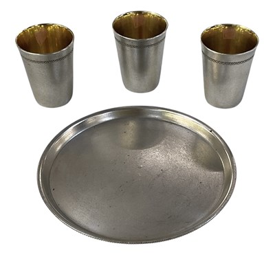 Lot 1052 - A Russian white metal vodka drinking set...