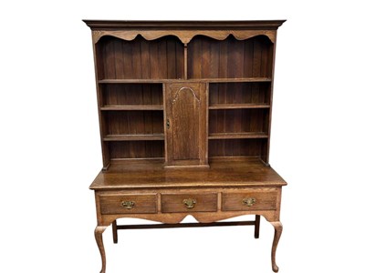 Lot 1028 - An 18th century style oak dresser, the plate...