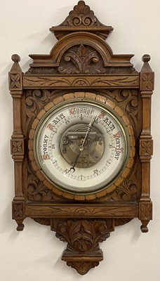 Lot 538 - A late Victorian carved oak barometer, 67 x 33 cm