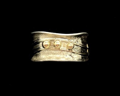 Lot 1159 - An abstract designed presumed silver ring with...