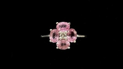 Lot 1160 - An 18ct white gold pink sapphire and diamond...