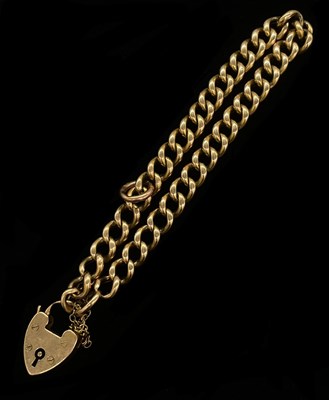 Lot 1280 - A yellow metal curb link bracelet with...