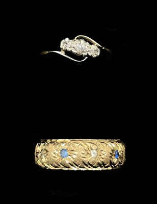 Lot 1282 - A 9ct yellow gold illusion set three stone...