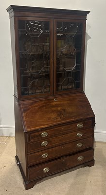Lot 1123 - An early 19th century mahogany bureau bookcase,...