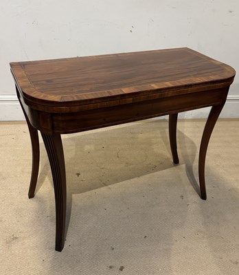 Lot 1137 - A Regency mahogany fold-over tea table, on...