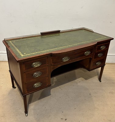 Lot 1124 - WARING & GILLOW; an Edwardian inlaid mahogany...