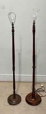 Lot 1256 - A beech standard lamp, and another similar,...