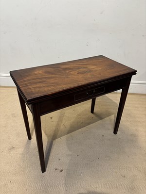 Lot 1259 - A George III fold-over tea table, with drawer,...